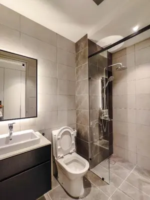 a bathroom with a toilet and a sink and a shower at The Axon Residence - Bukit Bintang Kuala Lumpur in Kuala Lumpur
