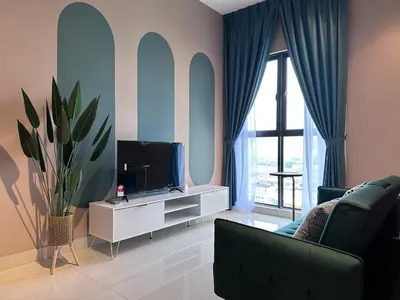 a living room with a tv and a couch at KL Trion Residence near Velocity - IKEA - Lalaport - Bukit Bintang in Kuala Lumpur