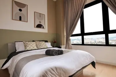 a bedroom with a large bed with a large window at The Play Suite@Pano. MRT. Free Parking. Self C/In in Kuala Lumpur