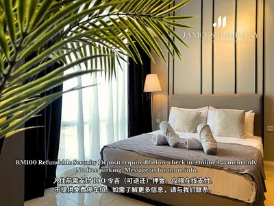 a bedroom with a bed with a plant next to a window at Axon Residences Bukit Bintang by Janice's Homestay in Kuala Lumpur