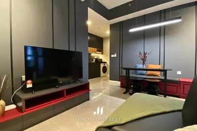 a living room with a flat screen tv on a wall at Axon Residences Bukit Bintang by Janice's Homestay in Kuala Lumpur