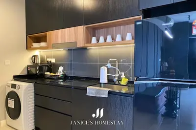 a kitchen with a sink and a counter top at Axon Residences Bukit Bintang by Janice's Homestay in Kuala Lumpur