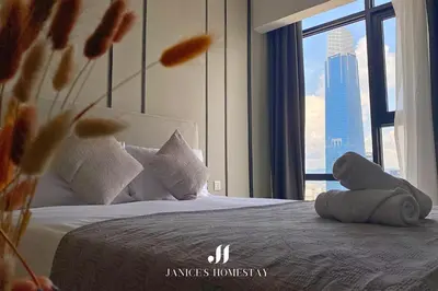 a hotel room with a bed with a large window at Axon Residences Bukit Bintang by Janice's Homestay in Kuala Lumpur