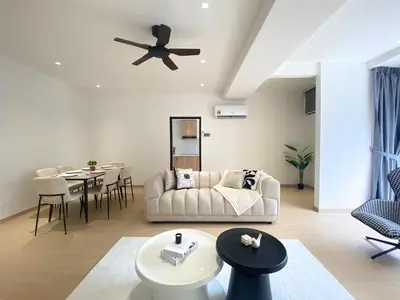 a living room with a couch and a table at KAĨTE Homestay at Fahrenheit88 Bukit Bintang, Opposite Pavilion KL in Kuala Lumpur