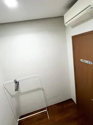 a room with a glass shelf and a door at Soho Suites, Centrally Located at KL City Centre in Kuala Lumpur