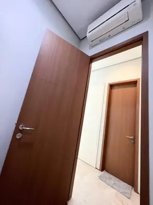 a wooden door in a room with a door sidx sidx at Soho Suites, Centrally Located at KL City Centre in Kuala Lumpur