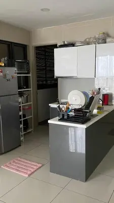a kitchen with a counter with dishes on it at Queen Room At KL Gateway Residence LRT Linked in Kuala Lumpur