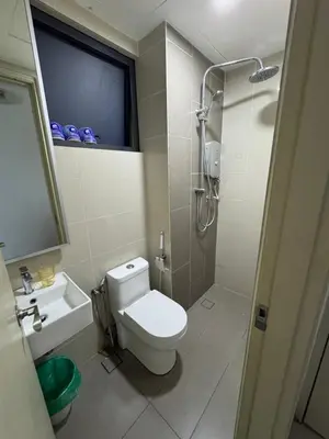 a bathroom with a toilet and a shower and a sink at Queen Room At KL Gateway Residence LRT Linked in Kuala Lumpur