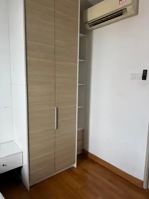 a closet with a wooden door in a room at Queen Room At KL Gateway Residence LRT Linked in Kuala Lumpur