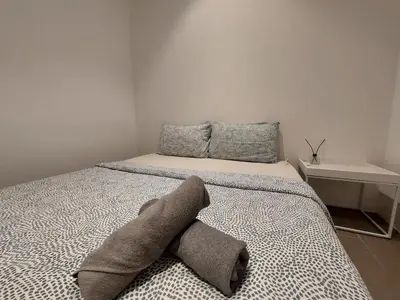a bedroom with a bed with a stuffed animal on it at KL Sentral, Est Bangsar#11, 7Pax in Kuala Lumpur