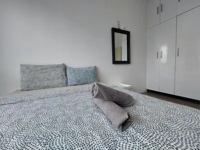 a bedroom with a large bed with a mirror at KL Sentral, Est Bangsar#11, 7Pax in Kuala Lumpur