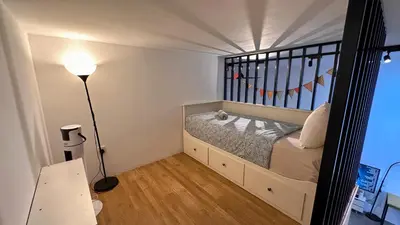 a small bedroom with a bed and a lamp at KL Sentral, Est Bangsar#11, 7Pax in Kuala Lumpur