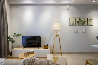a living room with a couch and a tv at 10 min to My town family unit By Nexx Field in Kuala Lumpur