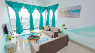 a living room with blue curtains and a couch at YOLO Budget Condo KL 5.0 in Kuala Lumpur