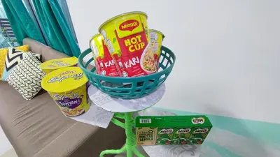 a basket of chips and other snacks on a table at YOLO Budget Condo KL 5.0 in Kuala Lumpur