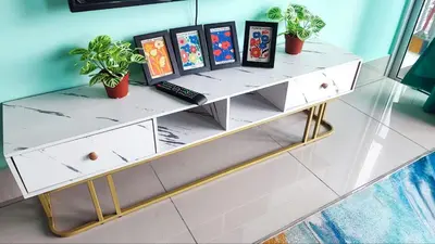 a shelf with paintings on it with plants on it at YOLO Budget Condo KL 5.0 in Kuala Lumpur