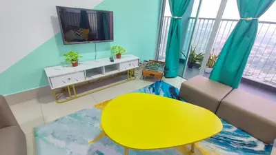 a living room with a yellow table and a yellow chair at YOLO Budget Condo KL 5.0 in Kuala Lumpur