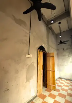 an empty room with a ceiling fan and a door at Bestow Boutique Hotel in Kuala Lumpur