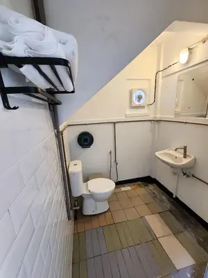 a bathroom with a toilet and a sink at Bestow Boutique Hotel in Kuala Lumpur
