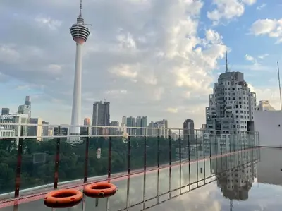 a view of a city with a view of the seattle tower at M101 KLCC KL city King Suites by Livin in Kuala Lumpur