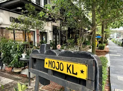 a sign that says moto kirk in front of a building at M101 KLCC KL city King Suites by Livin in Kuala Lumpur