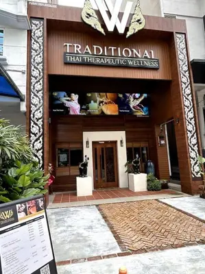 a building with a sign that reads tradition that therapeutic wellness at M101 KLCC KL city King Suites by Livin in Kuala Lumpur