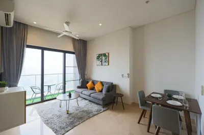 a living room with a couch and a table at Lucentia Residence At Kuala Lumpur By Dreamcloud in Kuala Lumpur