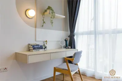 a desk and a chair in a room with a window at Quill Residences Kuala Lumpur, Five Senses in Kuala Lumpur
