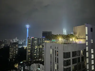 a view of a city at night with a light tower at Robertson Bukit Bintang with Netflix,TRX,KLCC in Kuala Lumpur