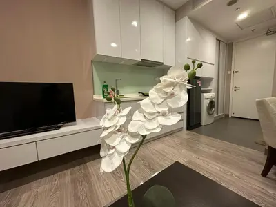 a white flower in the middle of a living room at One Bukit ceylon @ Bukit Bintang City Centre in Kuala Lumpur