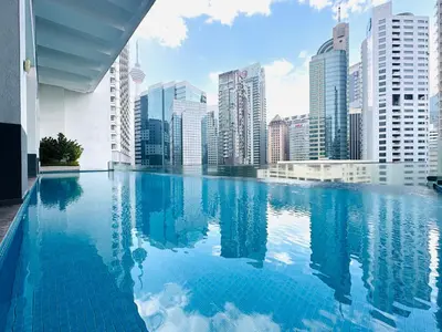 a swimming pool in a city with tall buildings at One Bukit ceylon @ Bukit Bintang City Centre in Kuala Lumpur