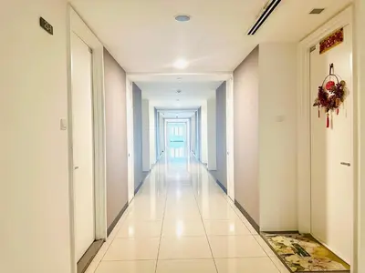 a long hallway with a door in a building at One Bukit ceylon @ Bukit Bintang City Centre in Kuala Lumpur