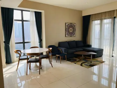 a living room with a couch and a table at Tribeca Serviced Hotel by Millennium in Kuala Lumpur