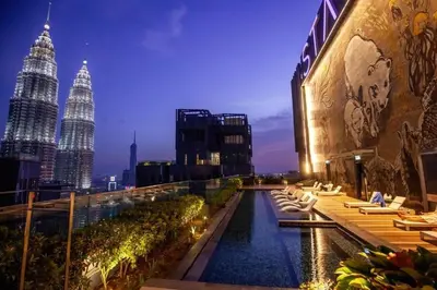 a rooftop pool on a building with a view of the city at Klcc suites at star - 2 bedroom in Kuala Lumpur
