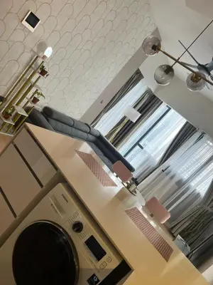 a bathroom with a washer and dryer in a room at Klcc suites at star - 2 bedroom in Kuala Lumpur