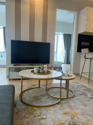 a living room with a coffee table and a couch at Klcc suites at star - 2 bedroom in Kuala Lumpur