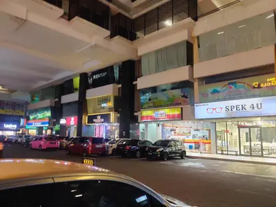 a city street with cars parked in front of buildings at MH Maison by Manhattan Group in Kuala Lumpur