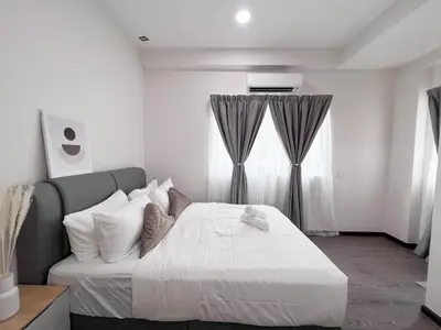 a bedroom with a white bed and a window at MH Maison by Manhattan Group in Kuala Lumpur
