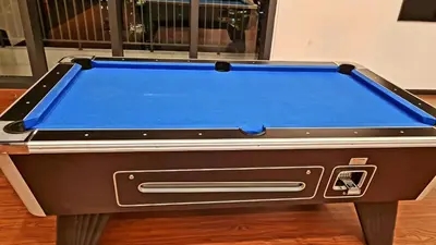 a pool table sitting on top of a table at Chambers Service Suites KLCC By Cozy Stay in Kuala Lumpur