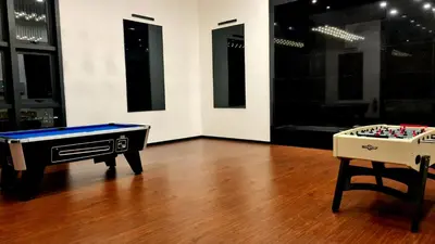 a room with a ping pong table and two chessboards at Chambers Service Suites KLCC By Cozy Stay in Kuala Lumpur
