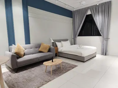 a living room with a couch and a table at Chambers Suites KL BY Fortune in Kuala Lumpur