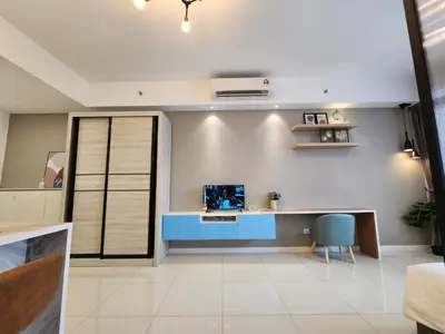 a room with a desk and a computer on a wall at Chambers Suites KL BY Fortune in Kuala Lumpur
