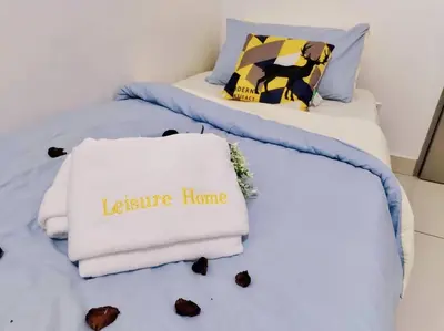 two beds with a sign that says leslie home at PWTC Titiwangsa HKL near MRT family in Kuala Lumpur