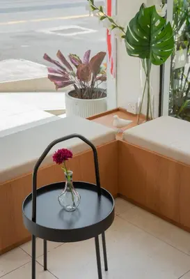 a vase with flowers on a table in a room at STAYS HOTEL in Kuala Lumpur
