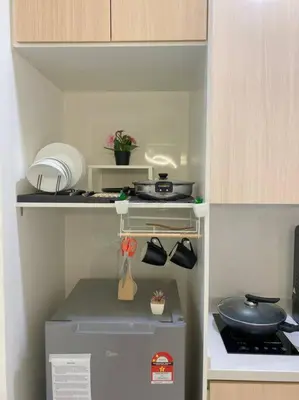 a miniature kitchen with a stove and a refrigerator at LOVELy Home For Small Family@KL in Kuala Lumpur