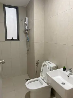 a white bathroom with a toilet and a sink at LOVELy Home For Small Family@KL in Kuala Lumpur