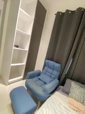 a bedroom with a blue chair and a bed at LOVELy Home For Small Family@KL in Kuala Lumpur
