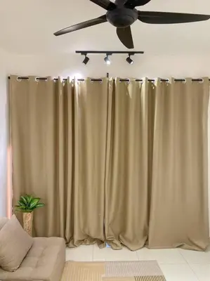 a living room with curtains and a ceiling fan at LOVELy Home For Small Family@KL in Kuala Lumpur