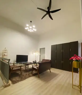 a living room with a ceiling fan and a table at KL Panorama View City in Kuala Lumpur