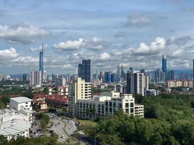 a city skyline with tall buildings and a road at KL Panorama View City in Kuala Lumpur